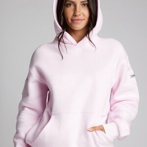 COMFRT travel essential hoodie color is powder pink